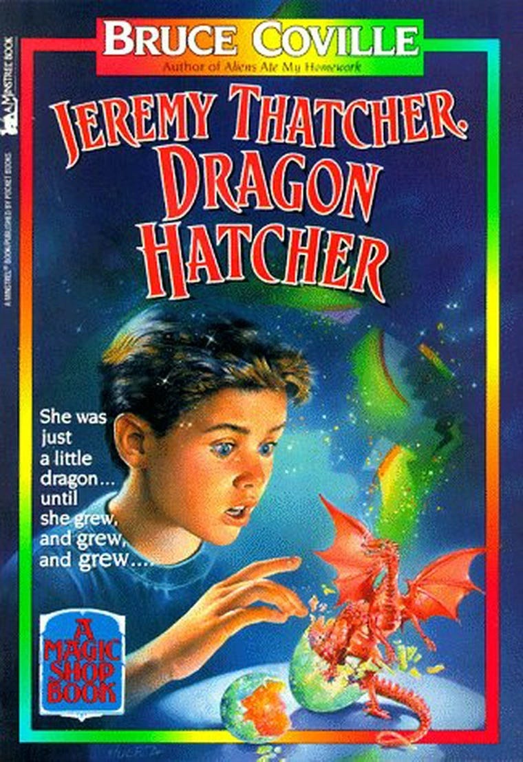 The cover of the book, entitled, Jeremy Thatcher, Dragon Hatcher. There is a boy looking in wonder at a small red dragon.