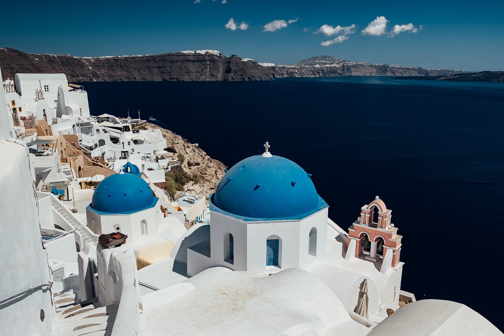 Famous blue domes of Santorini.