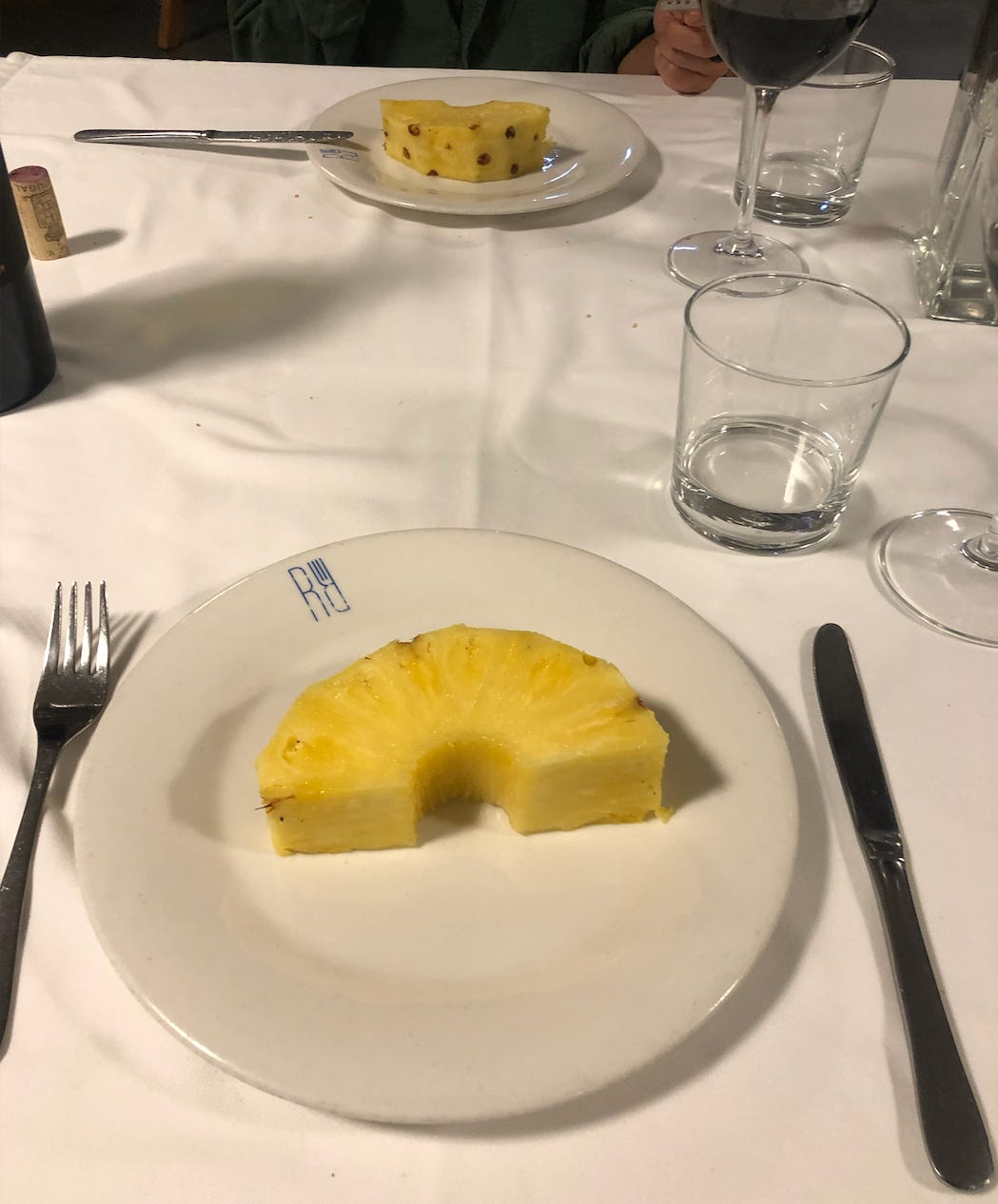 Our humble slice of pineapple, cut in two to share.