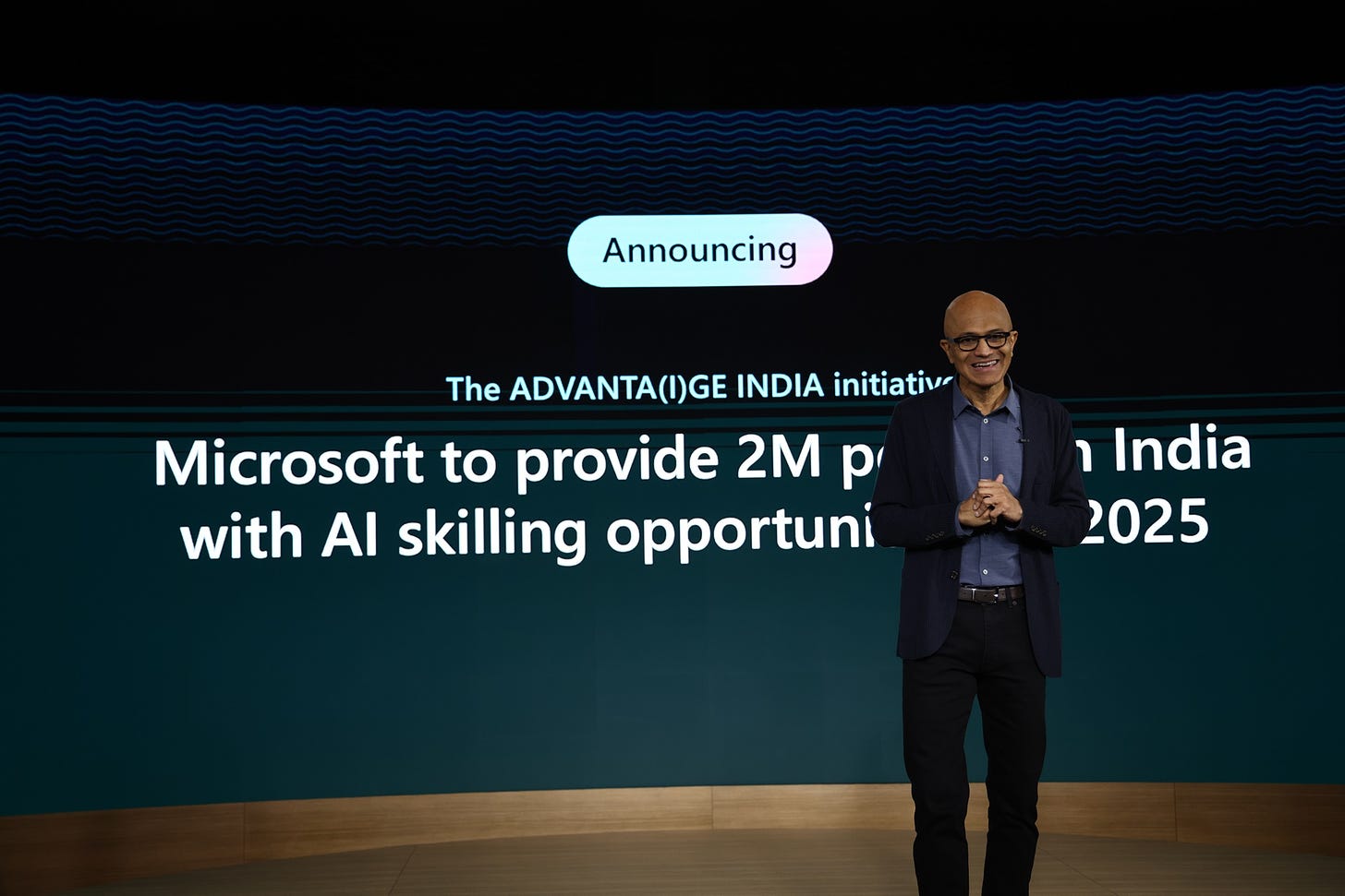 Microsoft chairman and CEO Satya Nadella giving a keynote address on stage