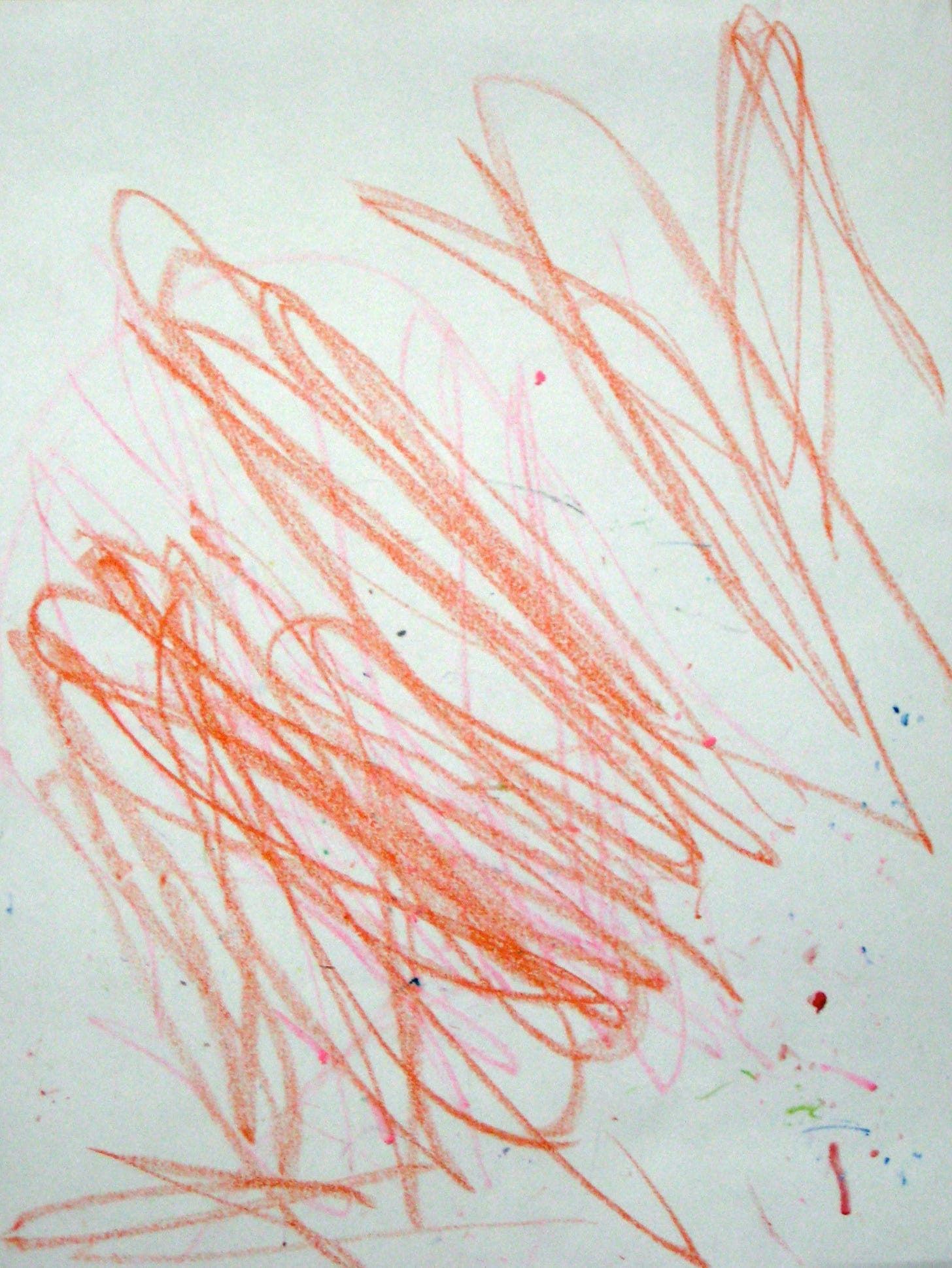 a crayon drawing with bold pink and orange scribbles and a sprinkling of dots in many colors