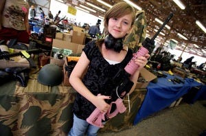 girl with pink rifle