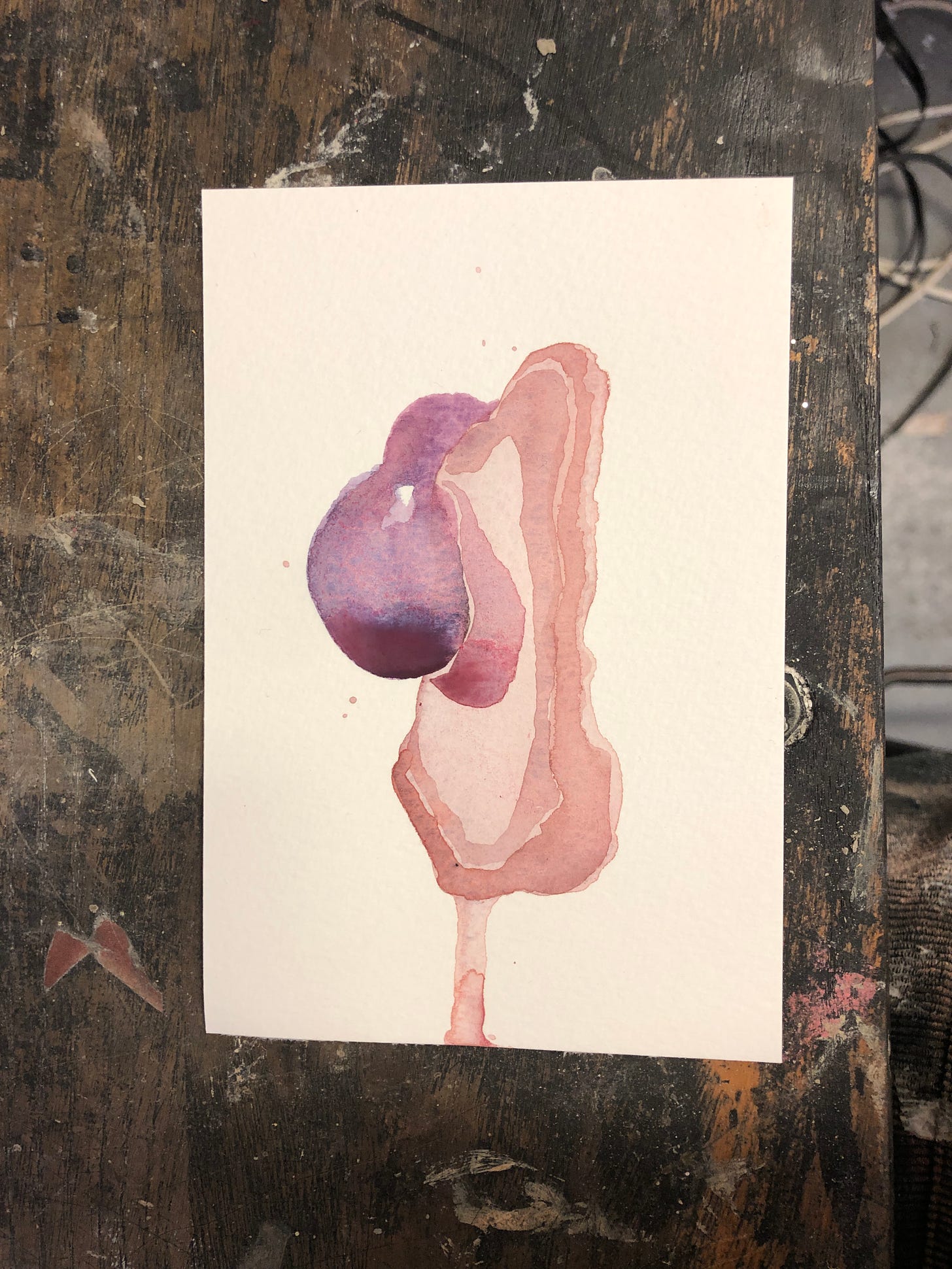 A small watercolour painting of what looks like an organ, painted in watery flesh colours.