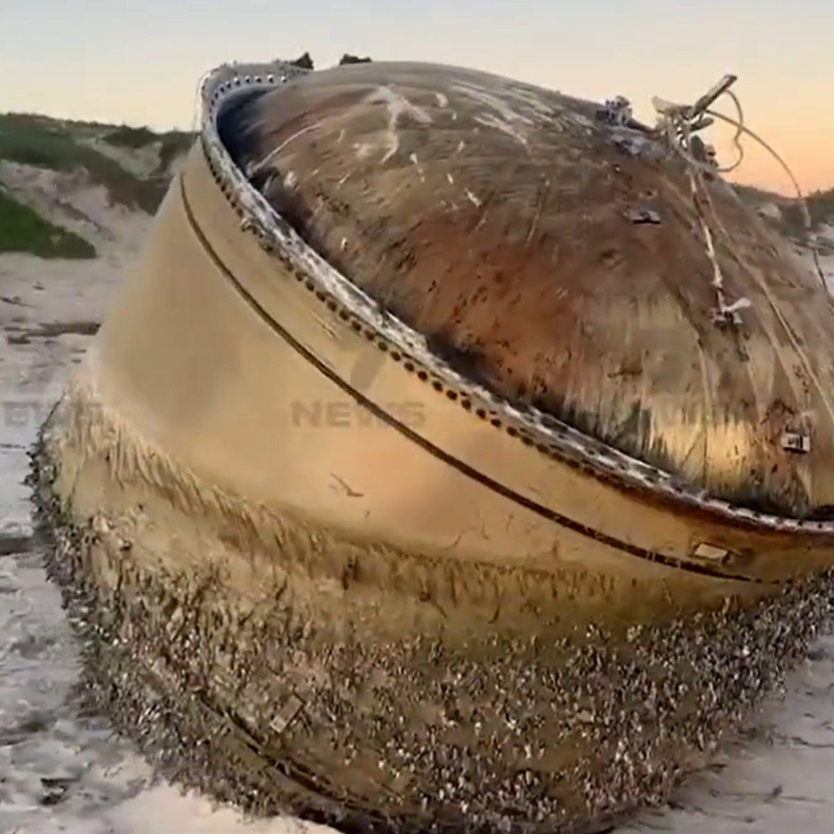 Mysterious giant cylinder washes up on Australian beach as officials urge  public to stay away | The Independent