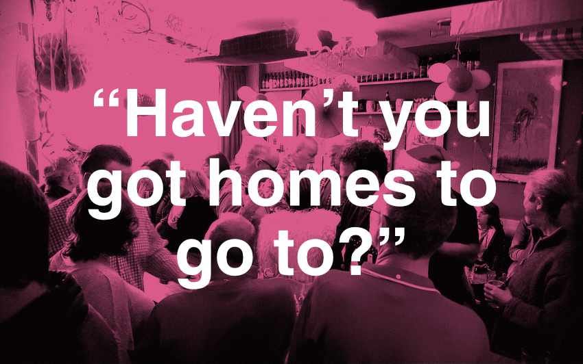 A crowded pub on Christmas Day overlaid with the text "Haven't you got home to go to?"