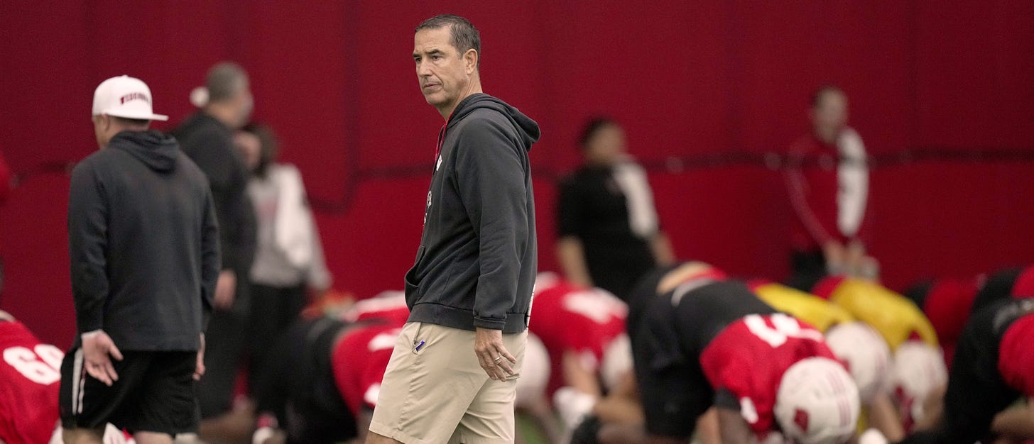 Wisconsin Badgers head coach Luke Fickell walks the field during spring football practice 