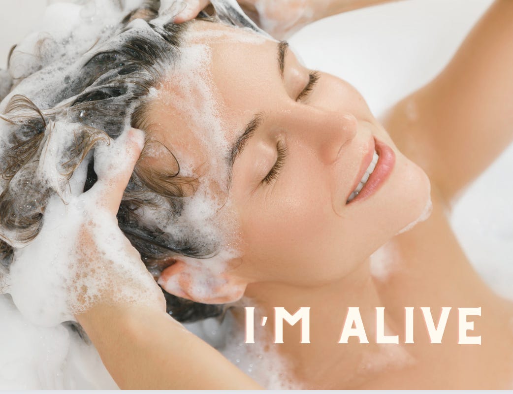 Woman washing soapy water in her hair-Caption “I’m Alive”