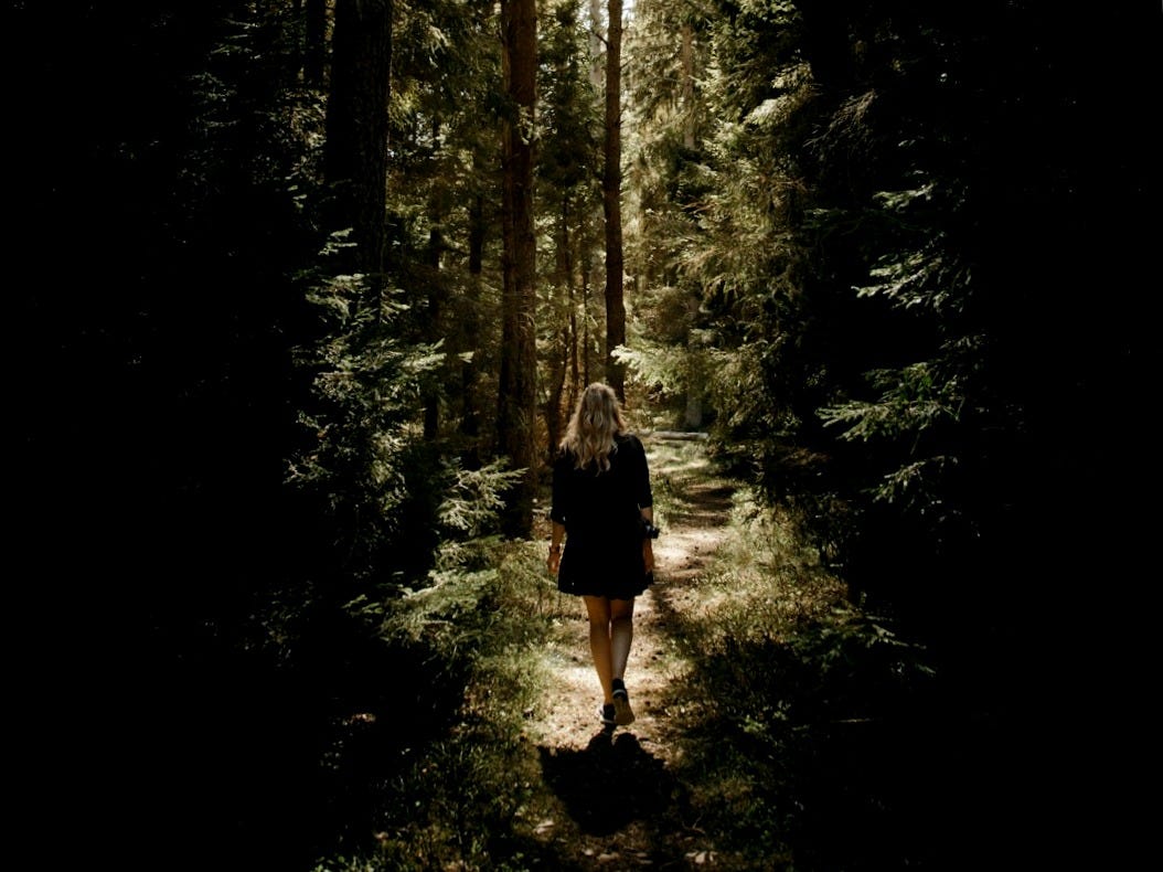 woman walking in the forest