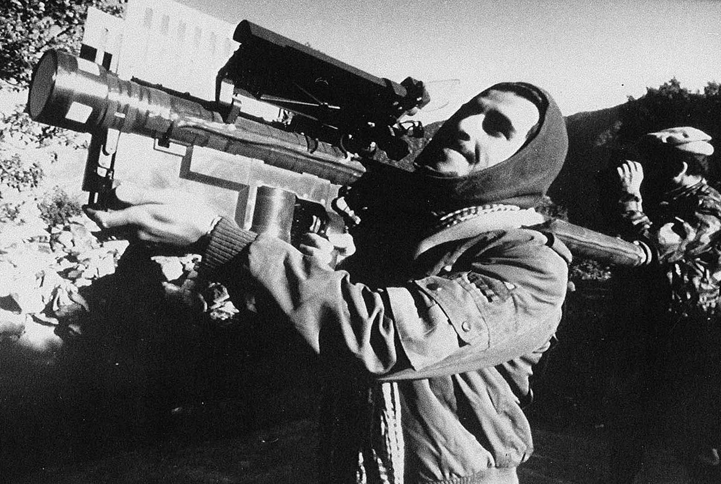 An Afghan guerrilla handles a U.S.-made Stinger anti-aircraft missile in this photo made between November 1987 and January 1988. The shoulder-fired, heat-seeking missile supplied to the Afghan resistance by the CIA during the Soviet invasion of Afghanistan, is capable of bringing down low-flying planes and helicopters. At one point, late in the war, rebels were reportedly downing nearly one Soviet aircraft every day with Stinger missiles.