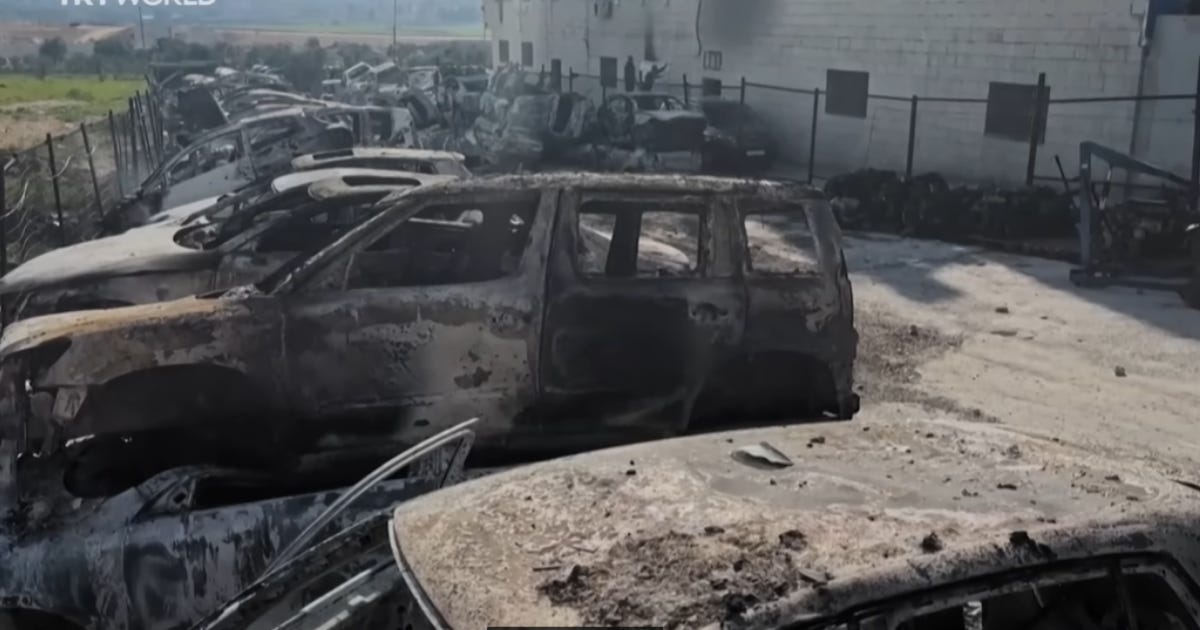 Image of cars torched by Israeli settlers, in a screencap from the documentary under discussion.