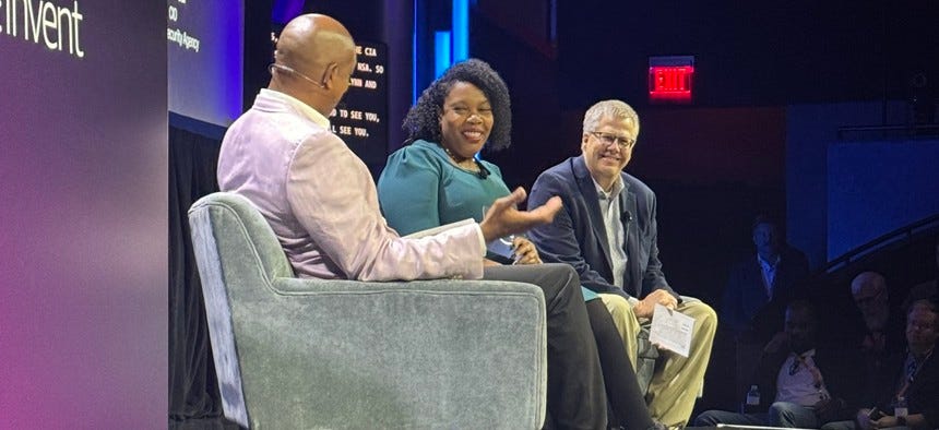  AWS Vice President of Worldwide Public Sector Dave Levy (L), CIA CIO La'Naia Jones and NSA CIO Scott Fear discuss the intelligence community's journey to cloud at the AWS re:Invent event in Las Vegas.