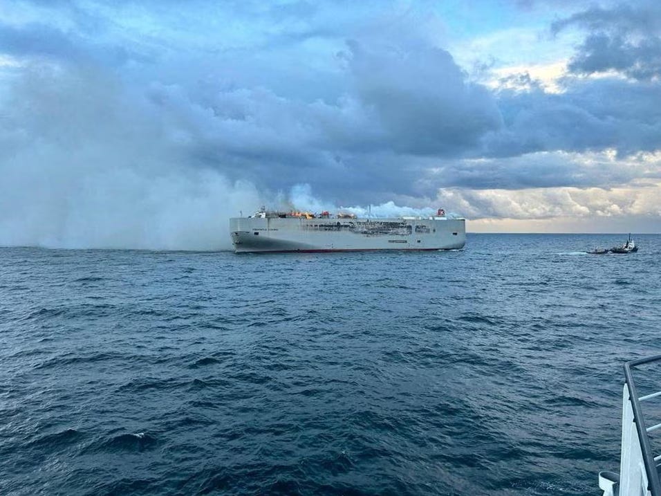 The Dutch freighter Fremantle Highway burning with over 4000 cars on board, nearly 500 EVs, where the fire likely originated.