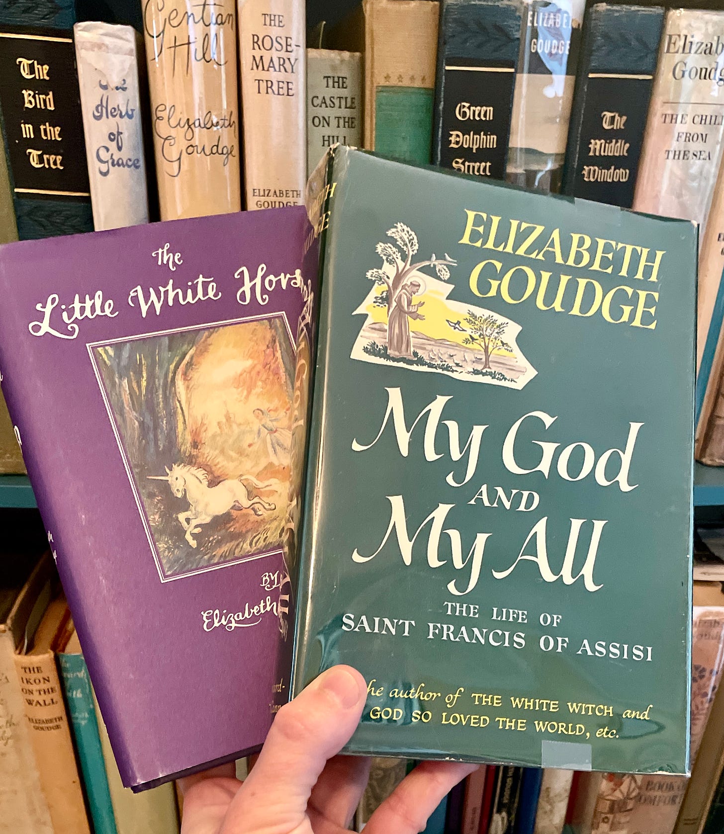 The Little White Horse and My God and My All by Elizabeth Goudge beside my Goudge bookcase.