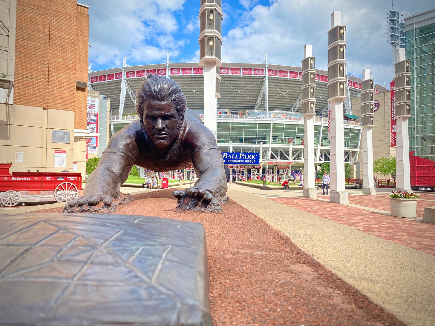 bronze of Pete Rose sliding onto a base