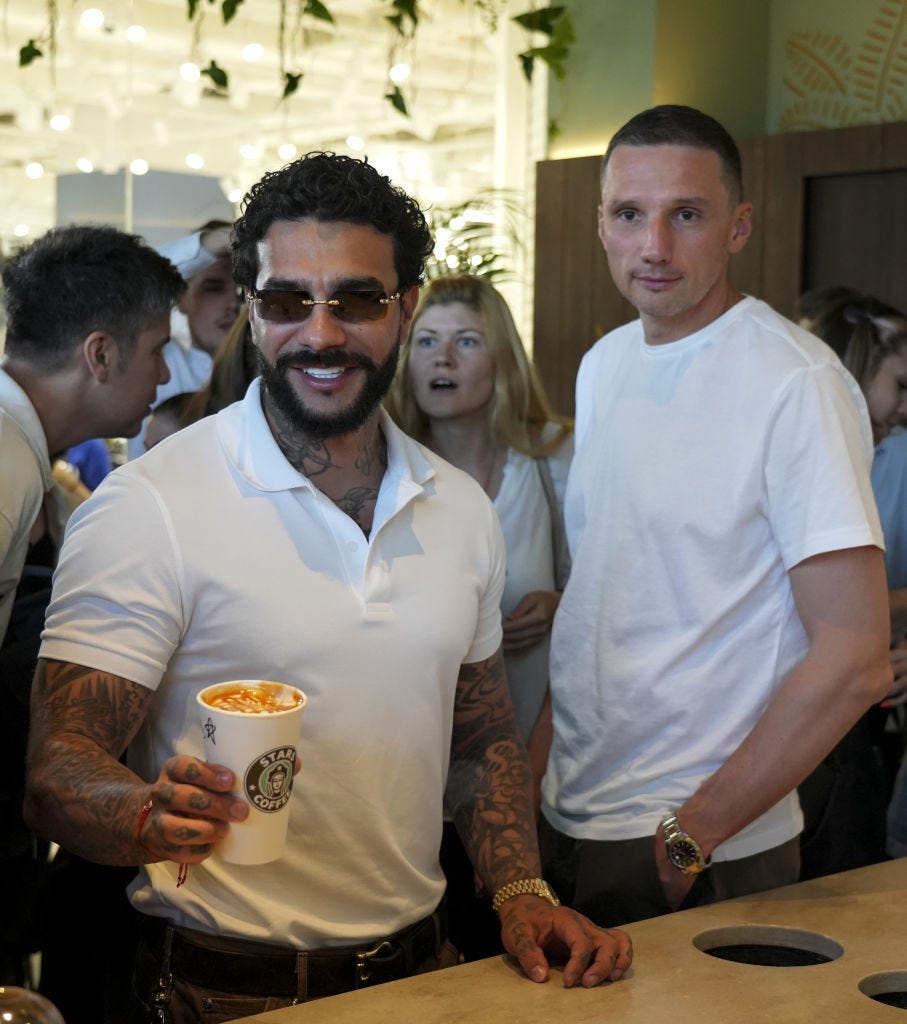 Russian rapper Timur Yunusov, known as Timati, holds a coffee cup with logo of Stars Coffee after former Starbucks coffee shops are reopened as Stars Coffee in Moscow, Russia on August 18, 2022