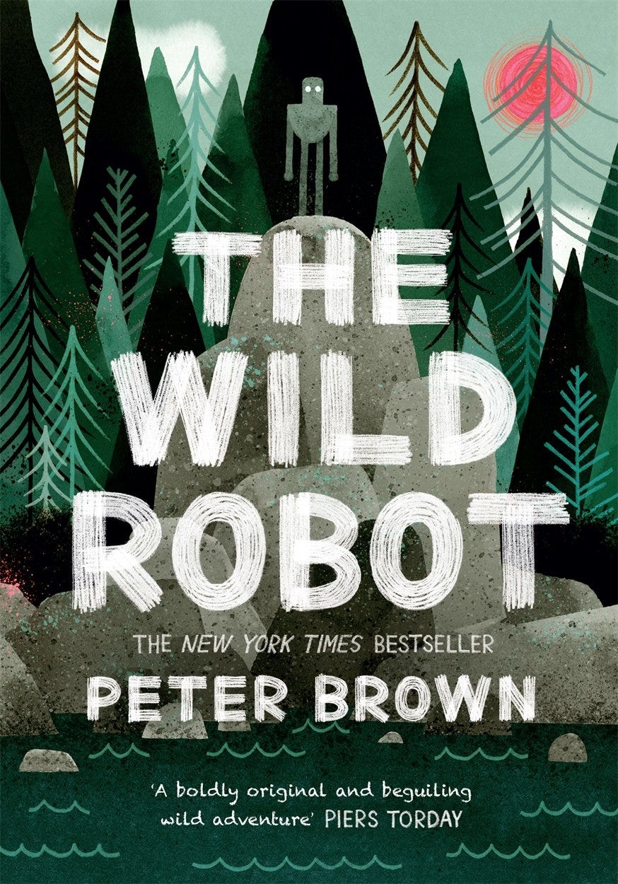 The cover of the Wild Robot shows a silver robot standing in the wilderness atop a pile of rocks