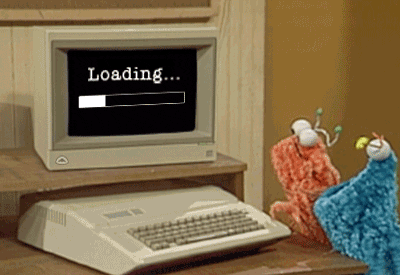 GIF of two muppets looking at a computer loading screen.