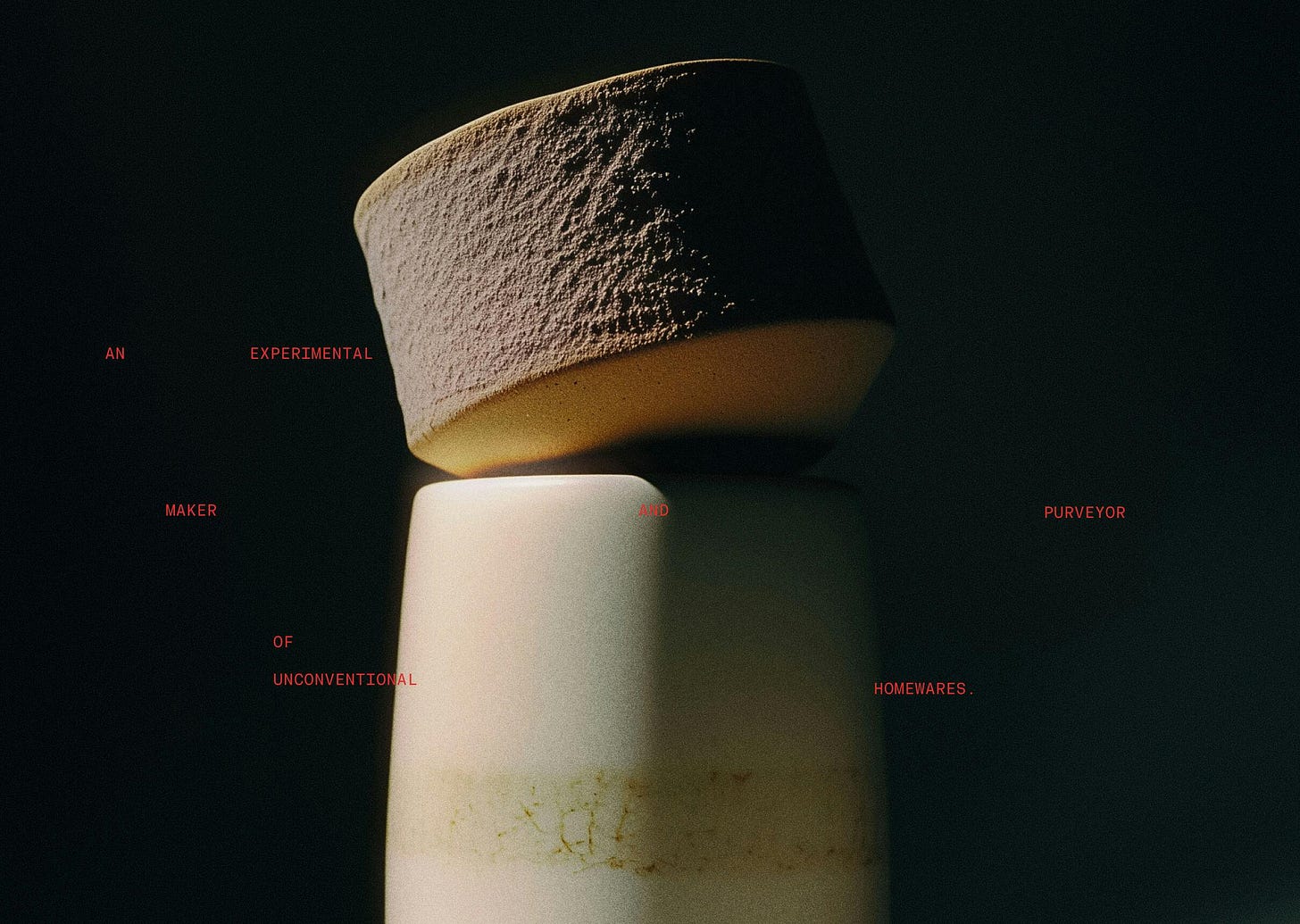 stacked ceramic objects in studio setting with text over top