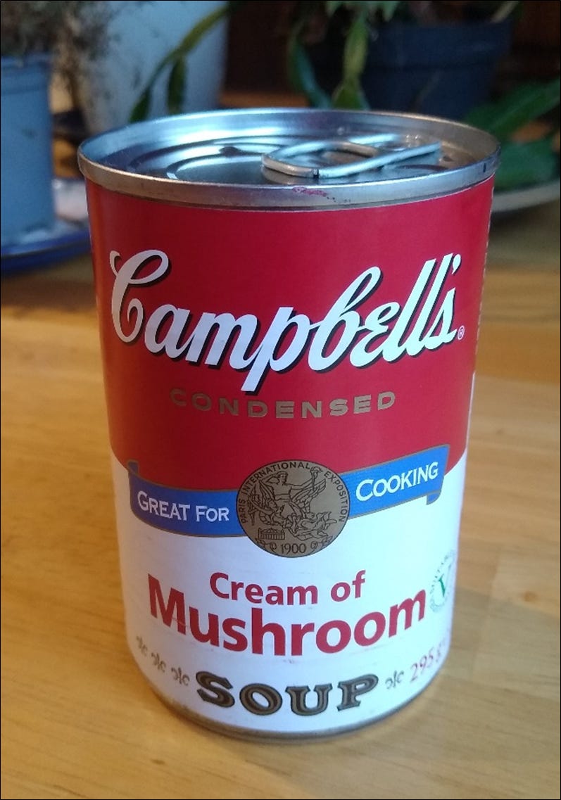 A photograph of a tin of Cambell's condensed cream of mushroom soup