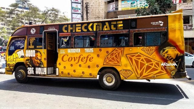 The photo shows a matatu with "covfefe" written on the side