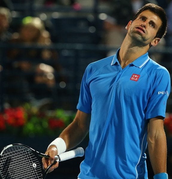 novak djokovic worn down by roger federer dubai 2015 iamges