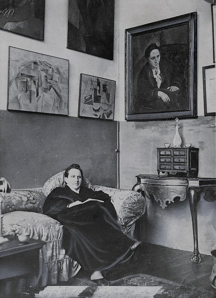 Gertrude Stein sitting on a sofa in her Paris studio - photograph
