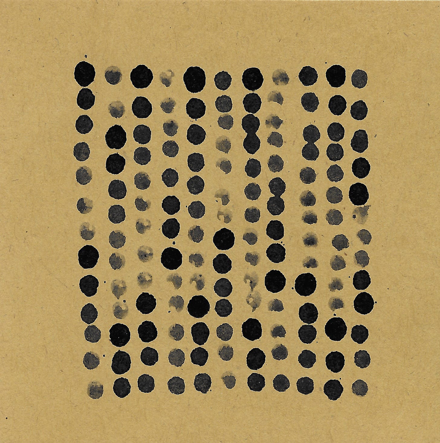 A grid of 11 black dots some dark and some faded across brown paper.