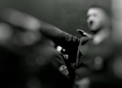 Hitler doing a salute with a lens blur obscuring most of the image.