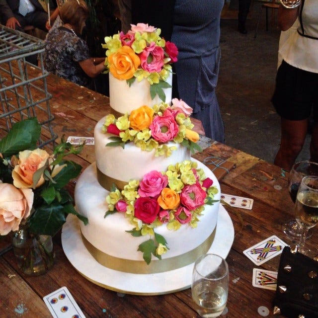 It's a three tiered wedding cake covered in roses.