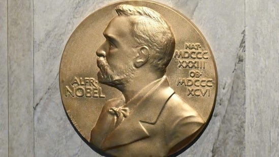 (FILES) This file photo taken on December 10, 2022, shows a plaque showing Swedish chemist, engineer, inventor, businessman, and philanthropist Alfred Nobel (1833-1896) on the podium during preparations ahead of the Nobel Prize award ceremony for literature, science and economy at the Concert Hall in Stockholm, Sweden. (Photo by Jonathan NACKSTRAND / AFP)(AFP)