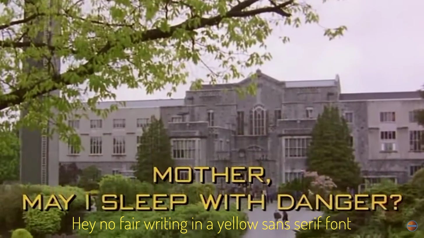 The title screen, in yellow text over a shot of a large college building. Captioned "hey no fair writing in a yellow sans serif font"