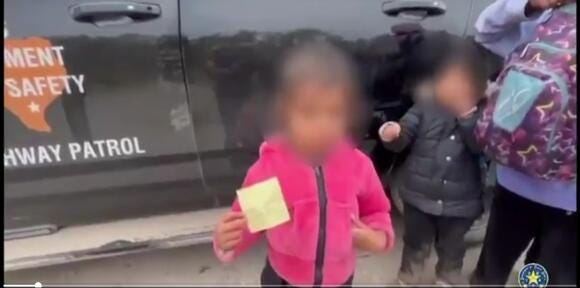 Migrant child presents family contacts to Texas DPS Officers