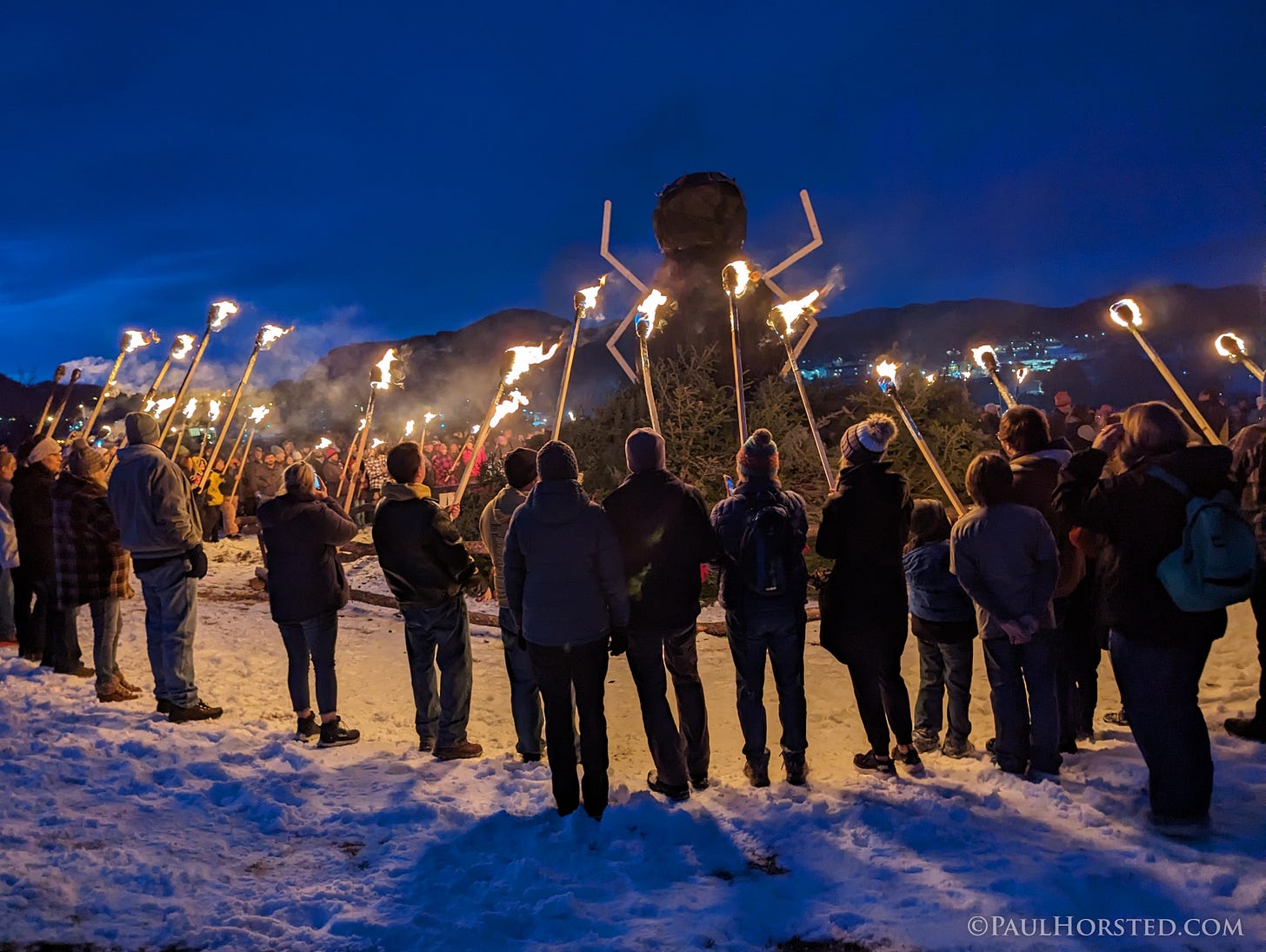 May be an image of 14 people, fire, fireworks, crowd and text