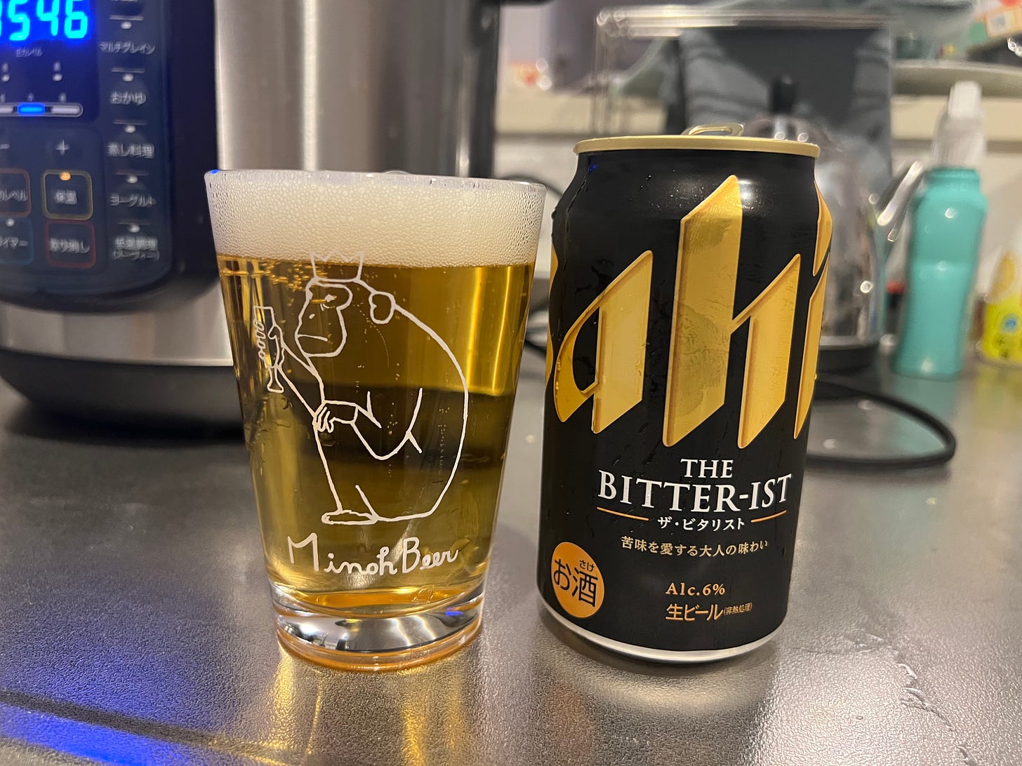 A picture of a can of Asahi's new beer The Bitter-ist poured into a half pint glass from Minoh Beer.