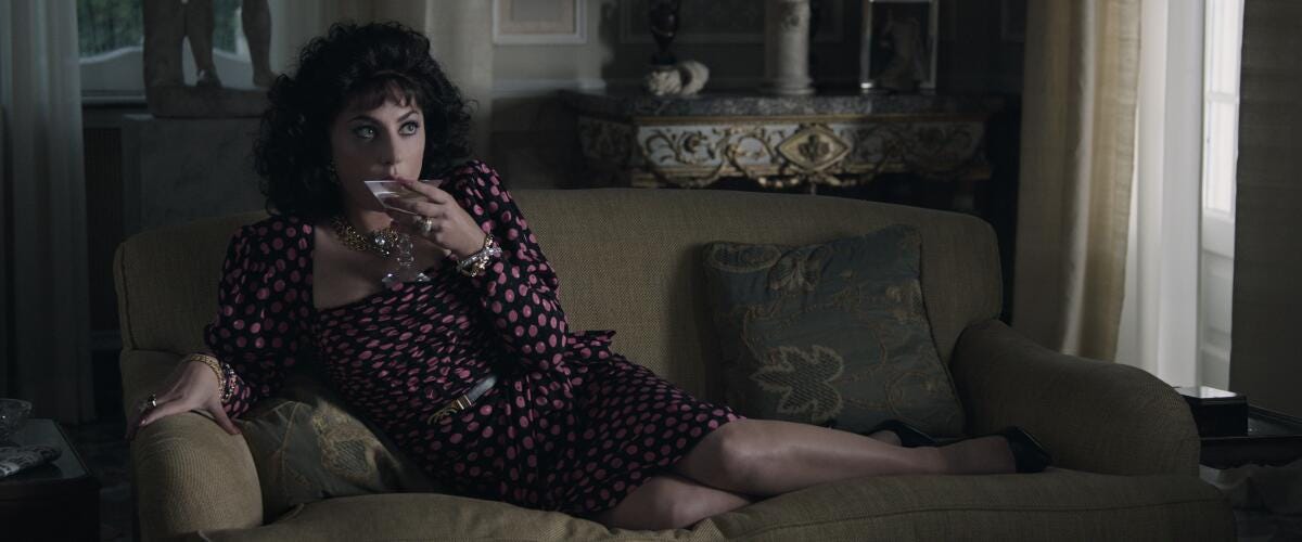 Lady Gaga as Patrizia in "House of Gucci," sipping a martini.
