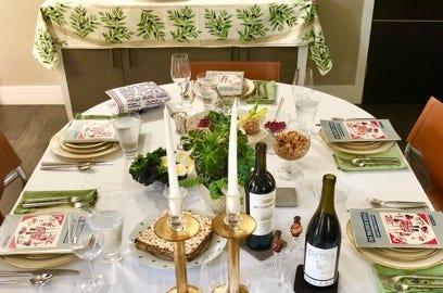 A table with food and wine on it

Description automatically generated