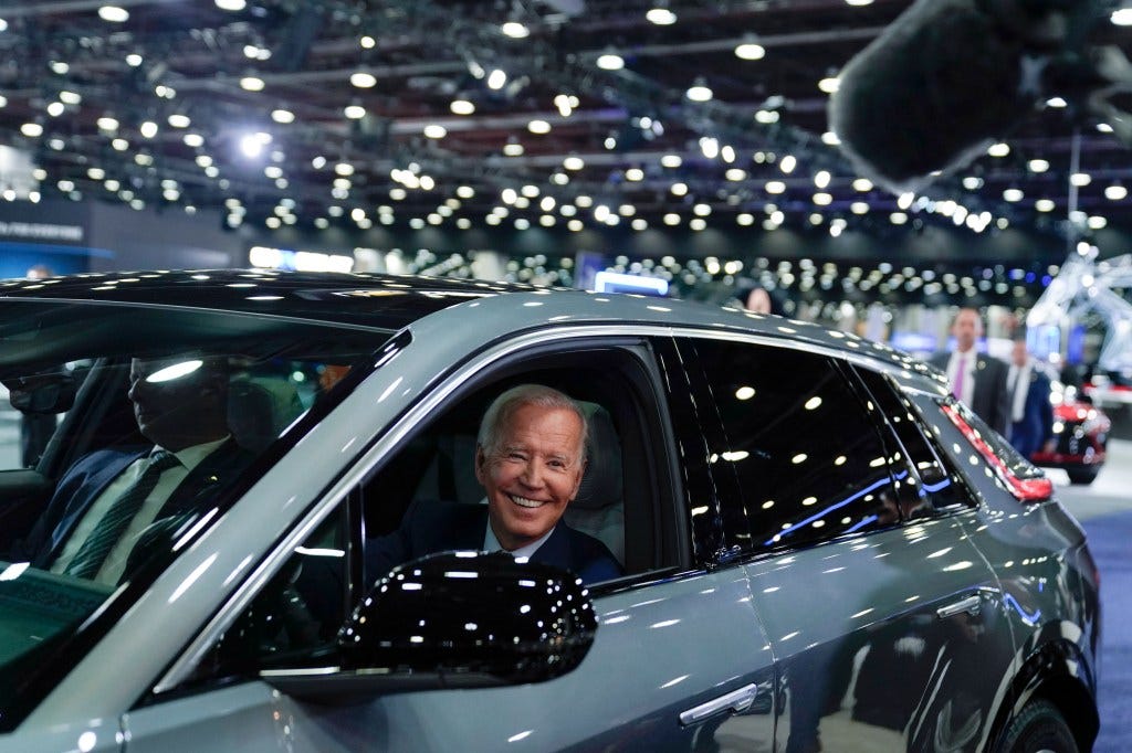President Biden in electric car