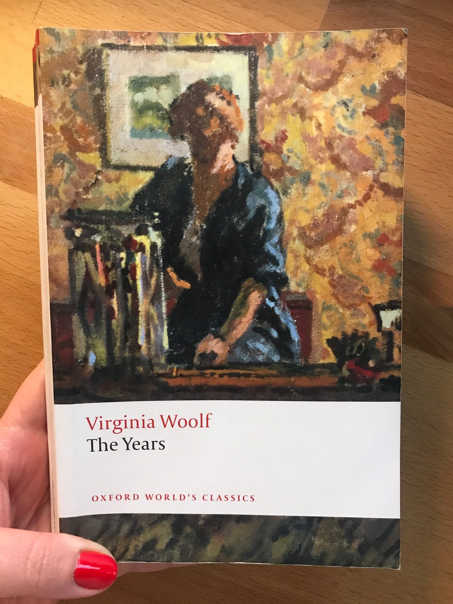 Paperback copy of Virginia Woolf's The Years (1937), with an impressionist painting of a woman at a desk on the cover.