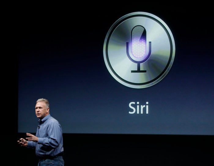 Phil Schiller introducing Siri at an Apple event in 2011