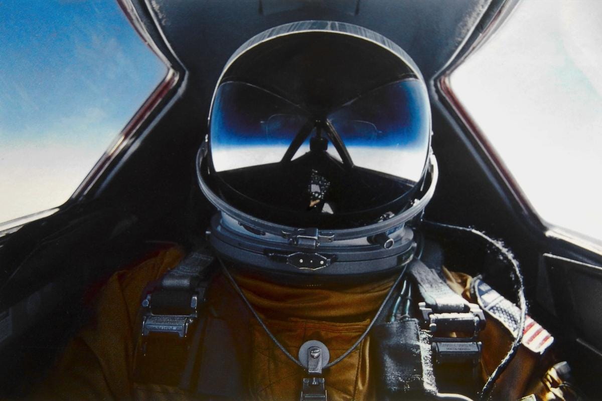 Self portrait: Brian Shul in his space suit, visor down as he flies the SR-71 Blackbird