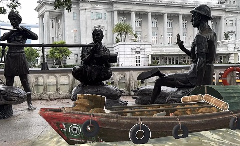 Photo of three statues by a boat in front of a river