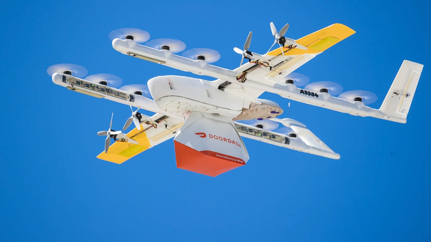 Image of a Wing drone carrying a DoorDash package