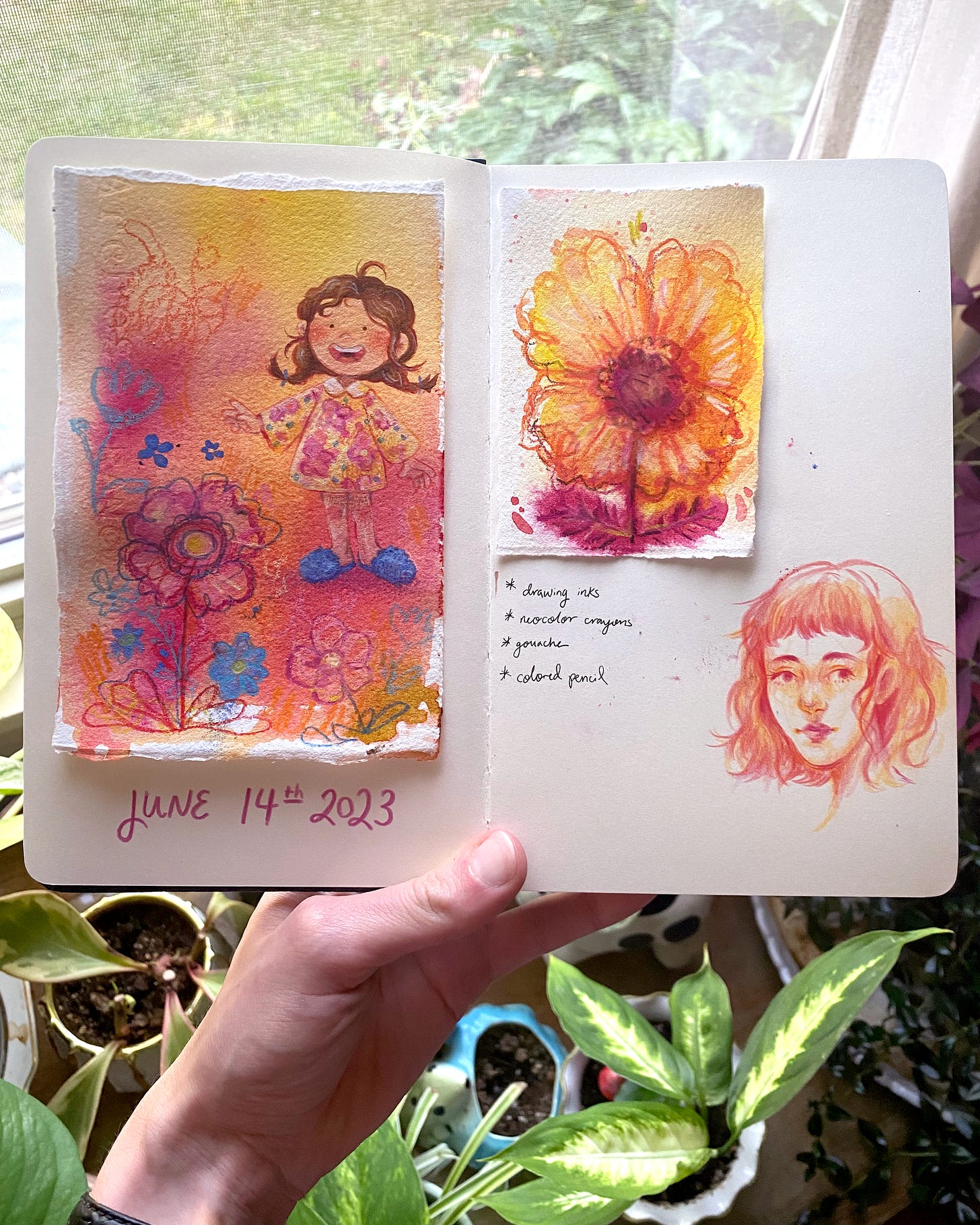 The illustrator holds up a spread from her sketchbook. The sketches are all done in warm colors, like pink, yellow, orange, and red. 