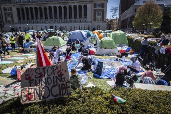 A sign sits erected at the pro-Palestinian demonstration encampment at Columbia University in New York, Monday, April 22, 2024. (AP Photo/Stefan Jeremiah)