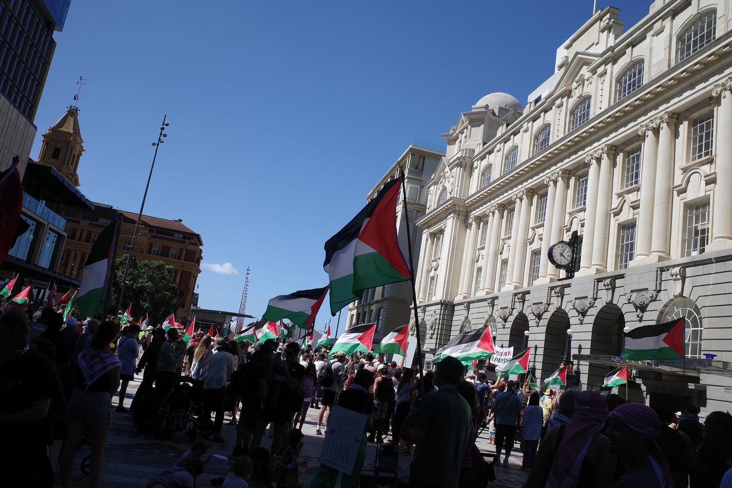 Another day at the Palestine march, with lots of people holding flags
