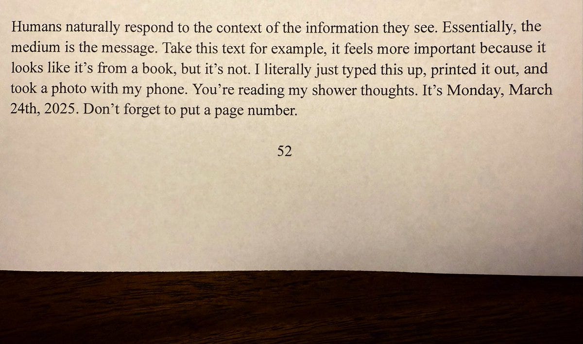 A photo of a printed page with serif text designed to resemble a book. The text reflects on how presentation influences perceived importance: “Take this text for example, it feels more important because it looks like it’s from a book, but it’s not.” It ends with a timestamp—Monday, March 24th, 2025—and a cheeky reminder to add a page number. At the bottom, the number “52” is centered like in a real book.