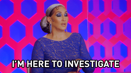 A gif of Michelle Visage sitting on the Drag Race judges panel and saying, "I'm here to investigate."
