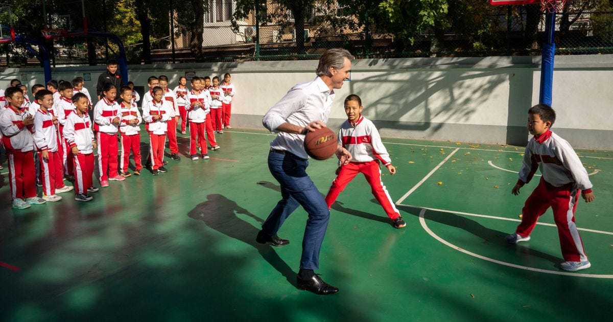 Watch Gavin Newsom Tackle a Kid in a Beijing Basketball Game