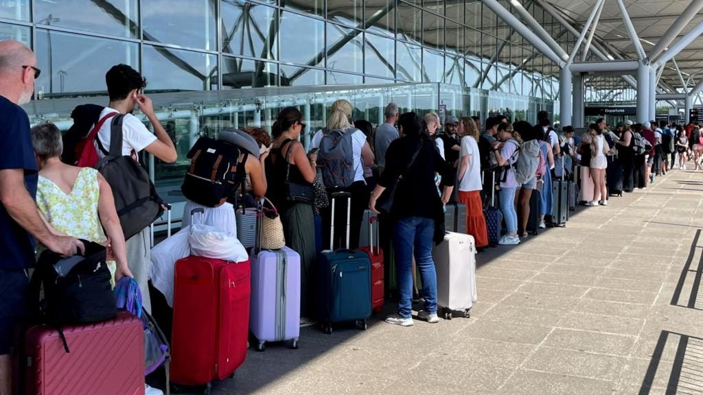 People queuing outside Stansted airport