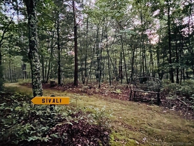 sign pointing to a cabin at Buddhist monastery called Sivali